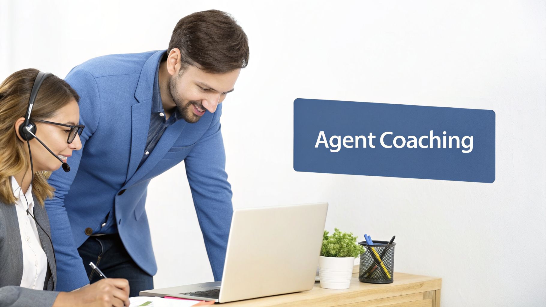 A male supervisor coaches a female call center agent wearing a headset while they look at a laptop, with text "Agent Coaching."